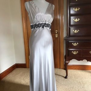 Long, silky, fancy gown.